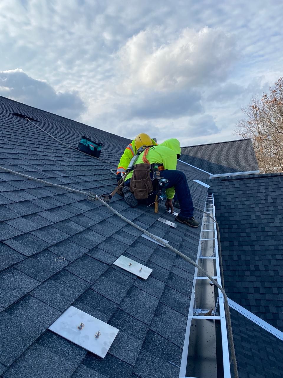 Professional roofer inspecting a roof
